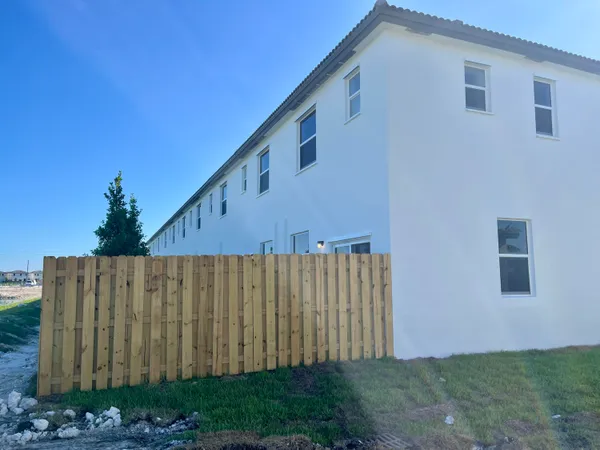 a view of a wooden fence