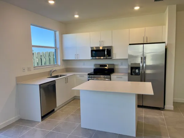 a kitchen with a stove and a sink