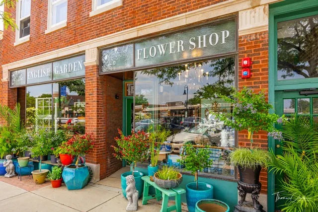 a view of a multi story building with a bunch of flowers