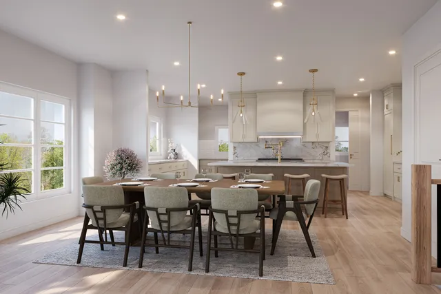 a kitchen with a dining table chairs and large counter top space
