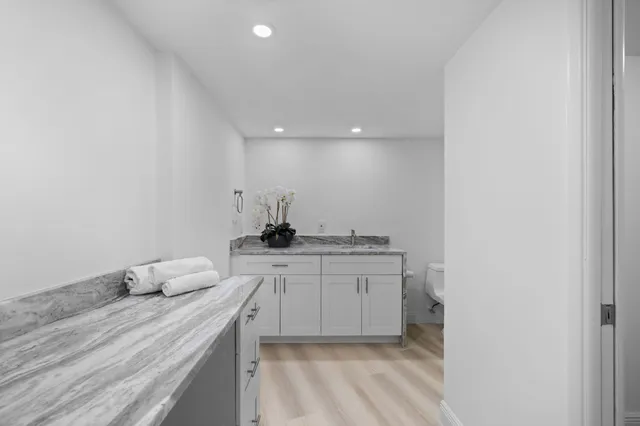 a room with a sink and a mirror