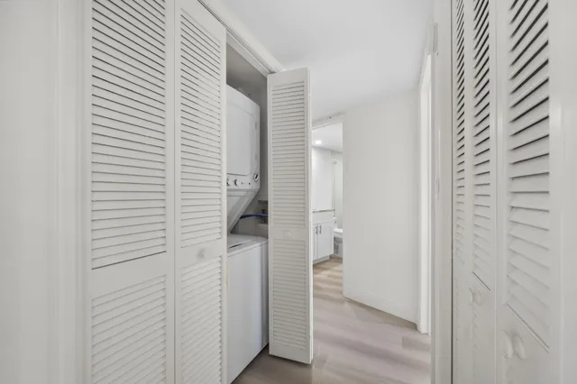 a view of hallway with wooden floor