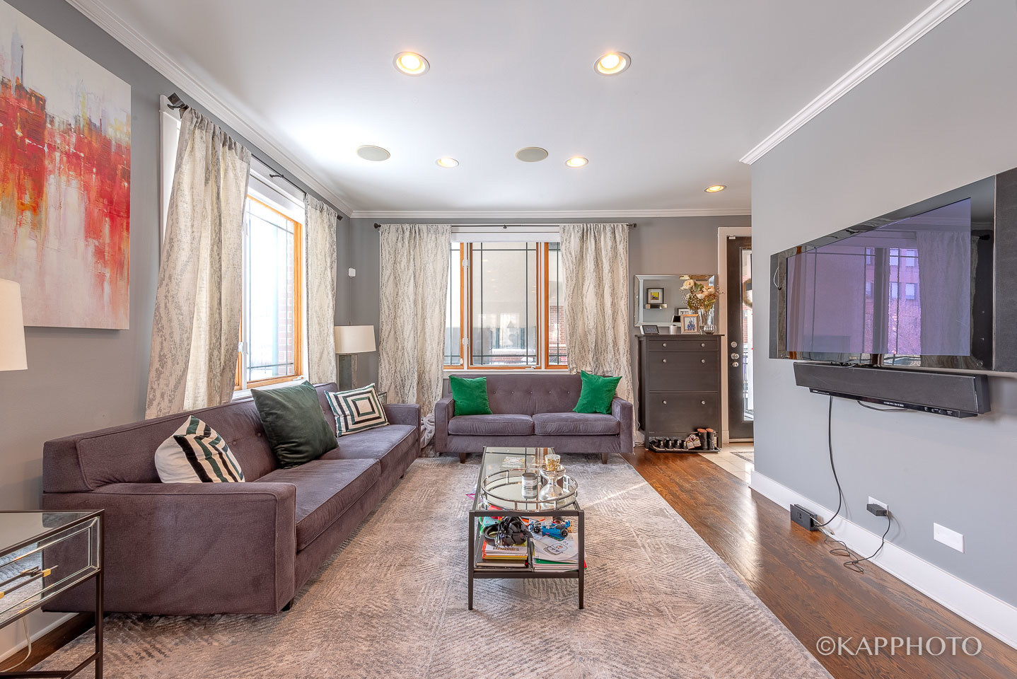 1 North Bishop Street, Unit 15 Chicago, IL 60607 - Photo 2 of 25 a living room with furniture and a flat screen tv