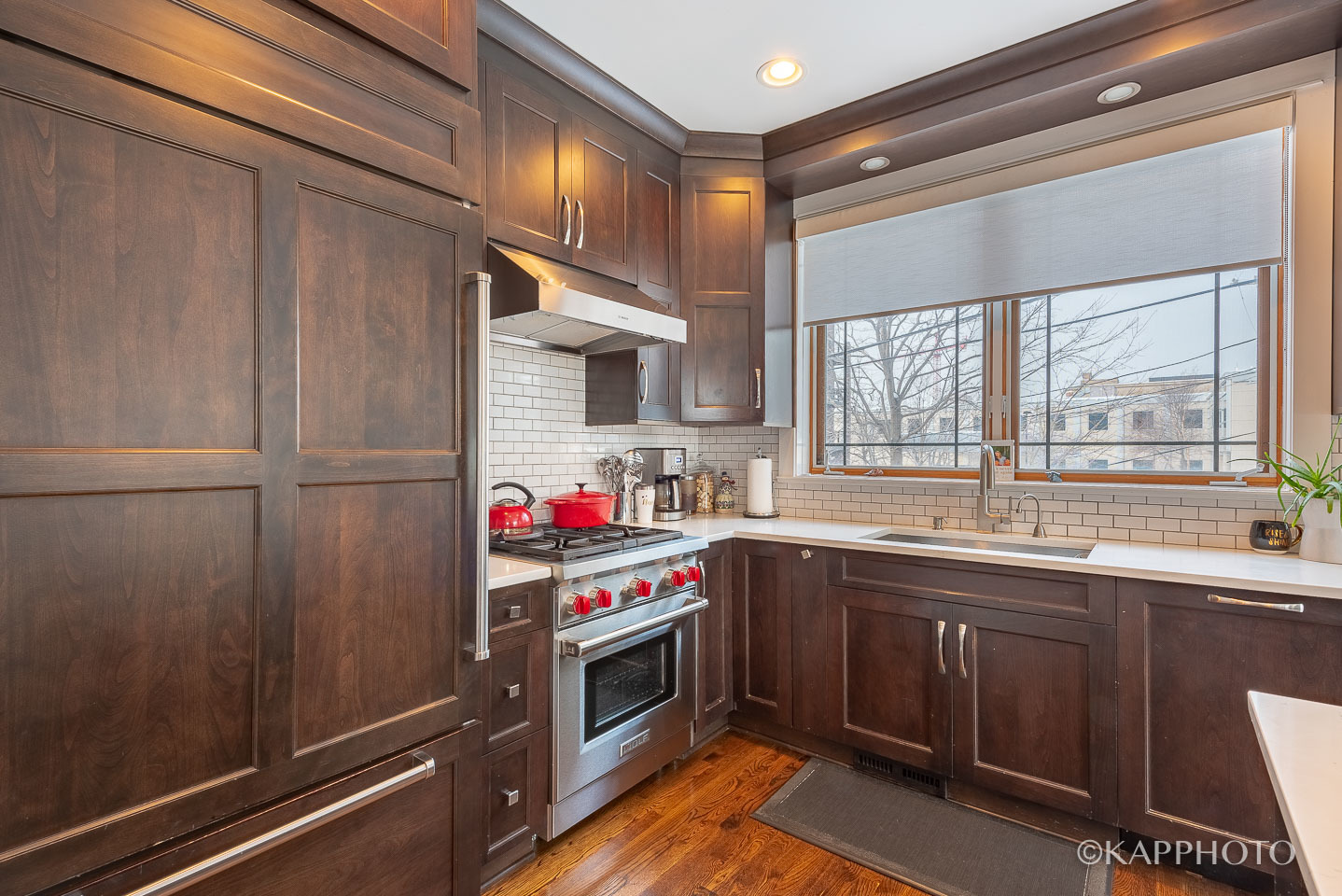 1 North Bishop Street, Unit 15 Chicago, IL 60607 - Photo 12 of 25 a kitchen with granite countertop a sink stainless steel appliances and cabinets