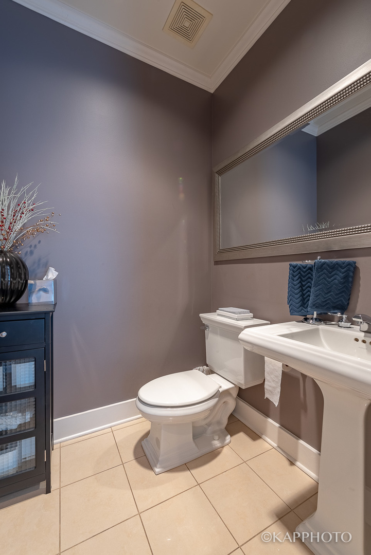 1 North Bishop Street, Unit 15 Chicago, IL 60607 - Photo 14 of 25 a bathroom with a toilet and a sink