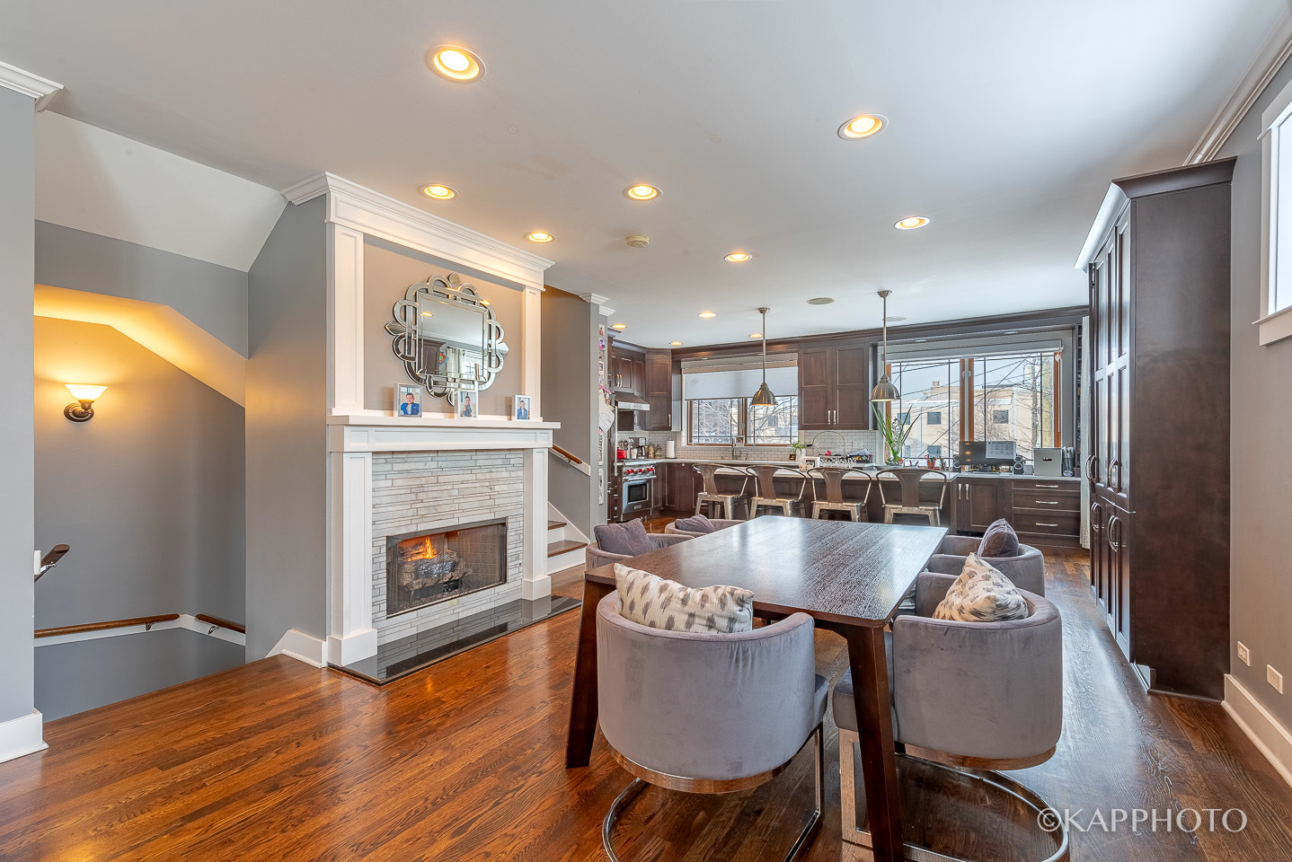 1 North Bishop Street, Unit 15 Chicago, IL 60607 - Photo 7 of 25 a dining table with fireplace and wooden floor