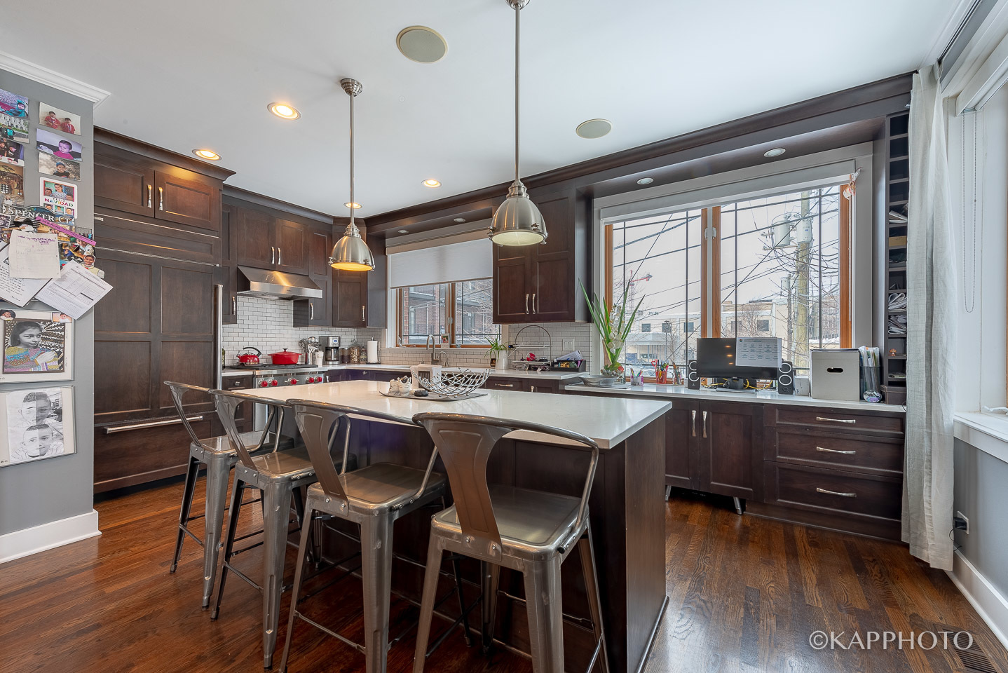 1 North Bishop Street, Unit 15 Chicago, IL 60607 - Photo 9 of 25 a kitchen with stainless steel appliances granite countertop a stove a refrigerator and a wooden cabinets
