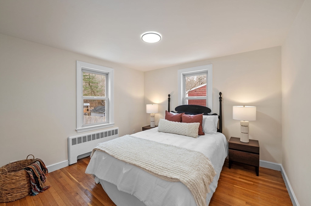 98 John Carver Road Reading, MA 01867 - Photo 17 of 40 a bedroom with a bed and a window