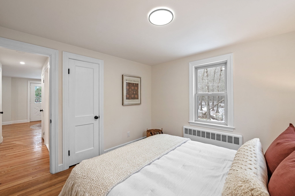 98 John Carver Road Reading, MA 01867 - Photo 18 of 40 a bedroom with a bed and a window