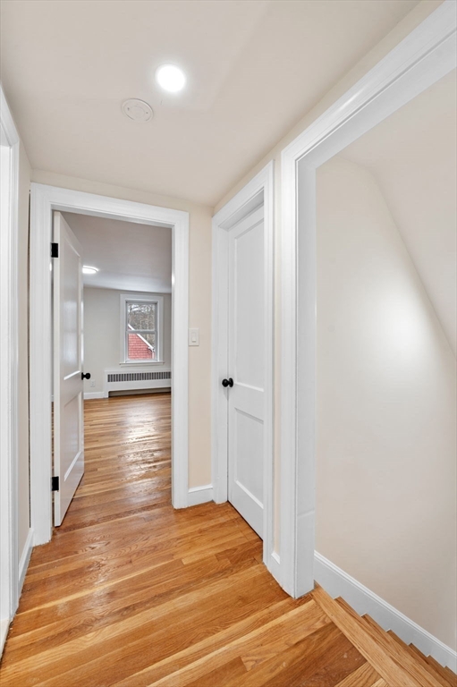 98 John Carver Road Reading, MA 01867 - Photo 19 of 40 a view of a room with wooden floor and staircase