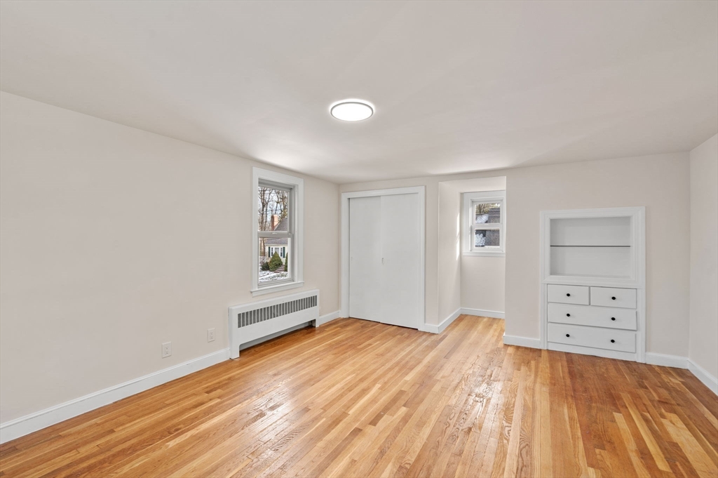 98 John Carver Road Reading, MA 01867 - Photo 25 of 40 wooden floor in an empty room