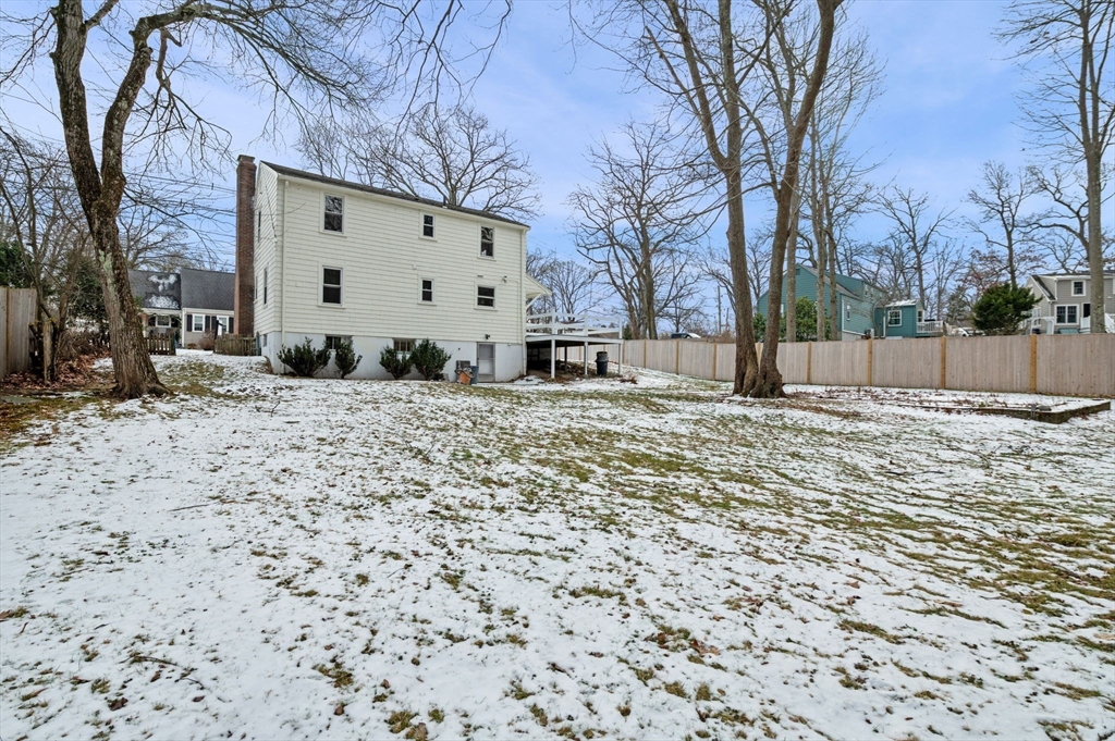 98 John Carver Road Reading, MA 01867 - Photo 35 of 40 a view of a yard with a snow