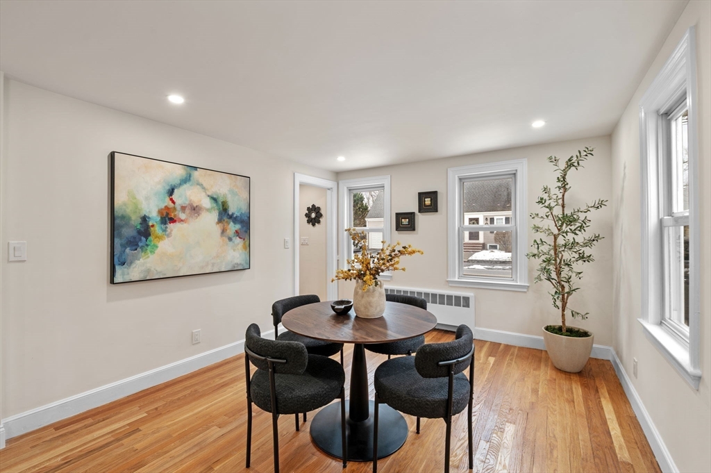 98 John Carver Road Reading, MA 01867 - Photo 7 of 40 a view of a dining room with furniture window and wooden floor