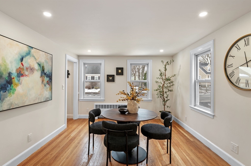 98 John Carver Road Reading, MA 01867 - Photo 8 of 40 a view of a dining room with furniture and wooden floor