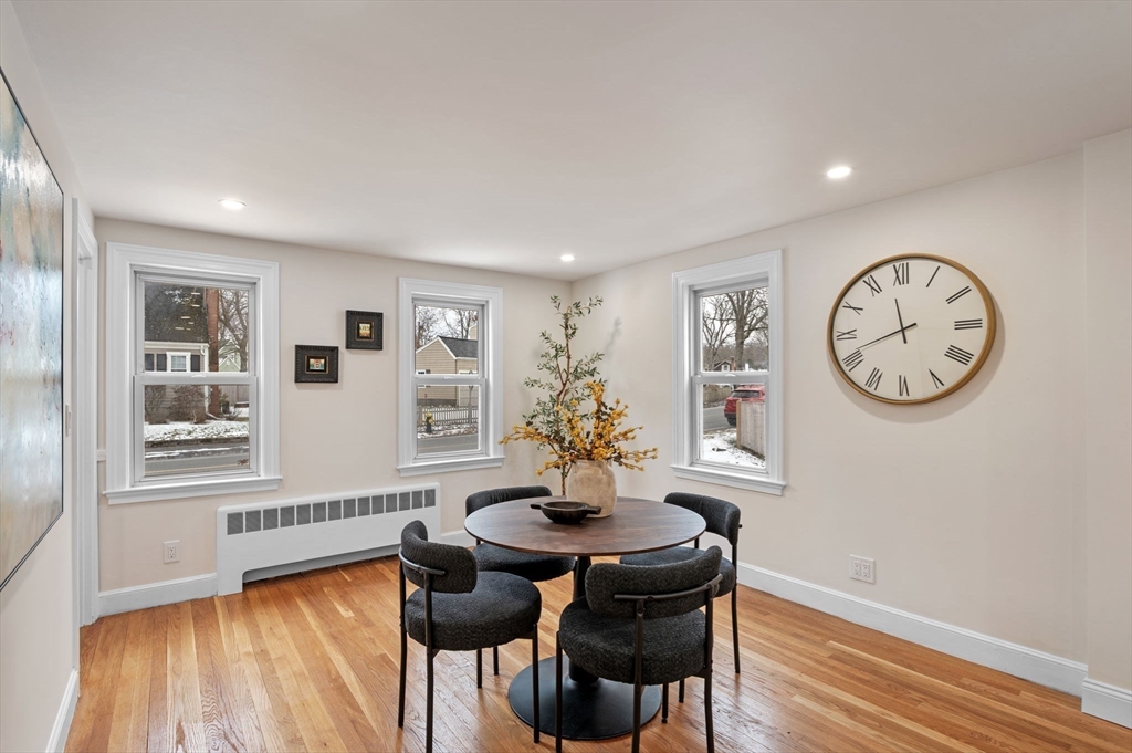 98 John Carver Road Reading, MA 01867 - Photo 9 of 40 a view of a dining room with furniture window and wooden floor