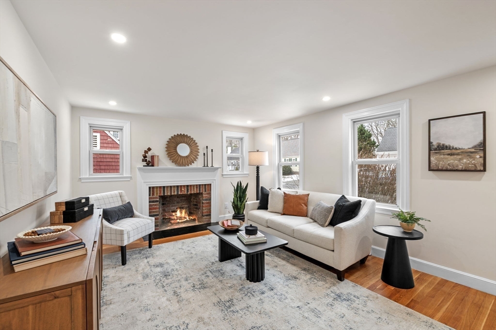 98 John Carver Road Reading, MA 01867 - Photo 10 of 40 a living room with furniture and a fireplace