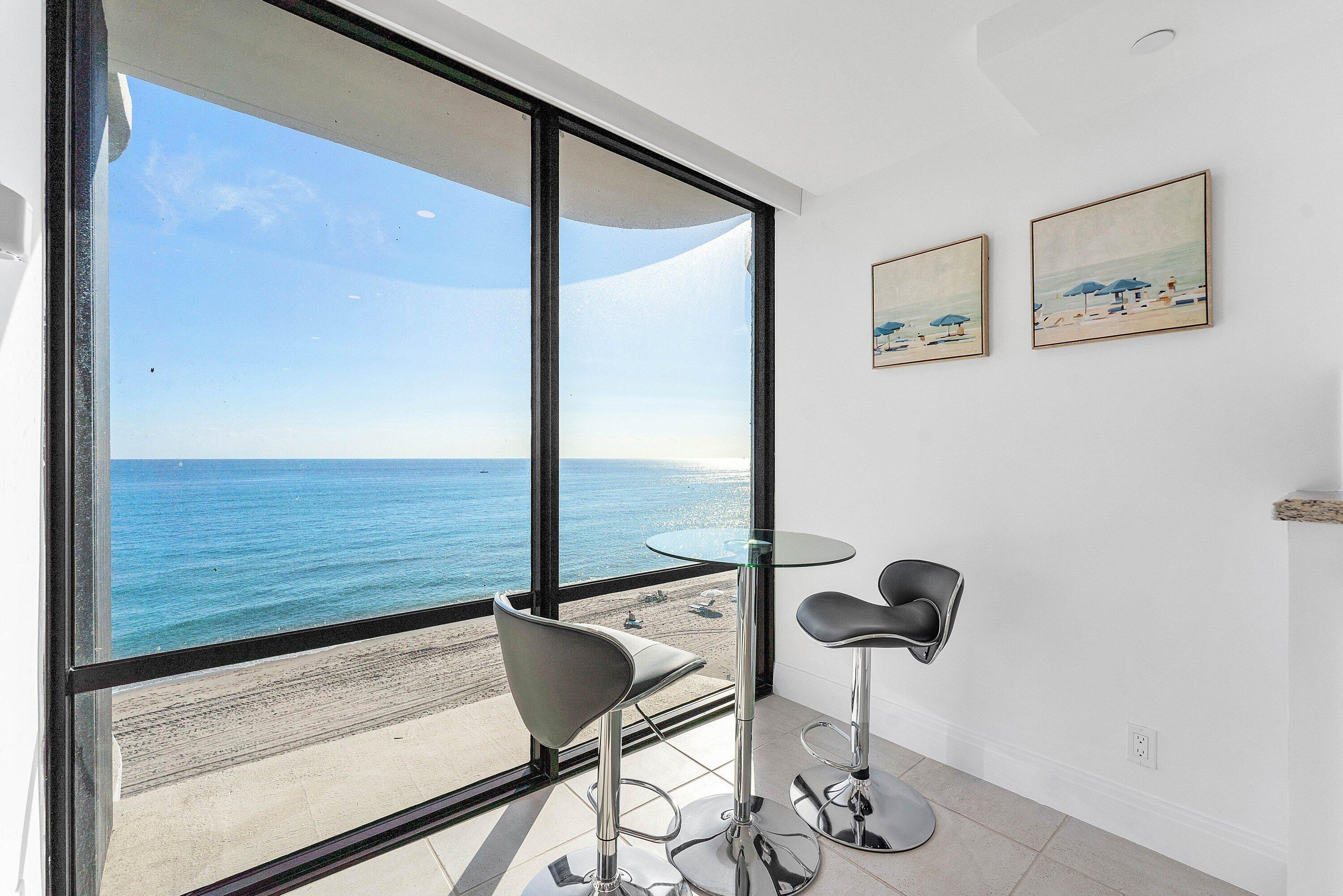 250 South Ocean Boulevard, Unit 4F Boca Raton, FL 33432 - Photo 18 of 45 a view of an empty room with wooden floor and windows