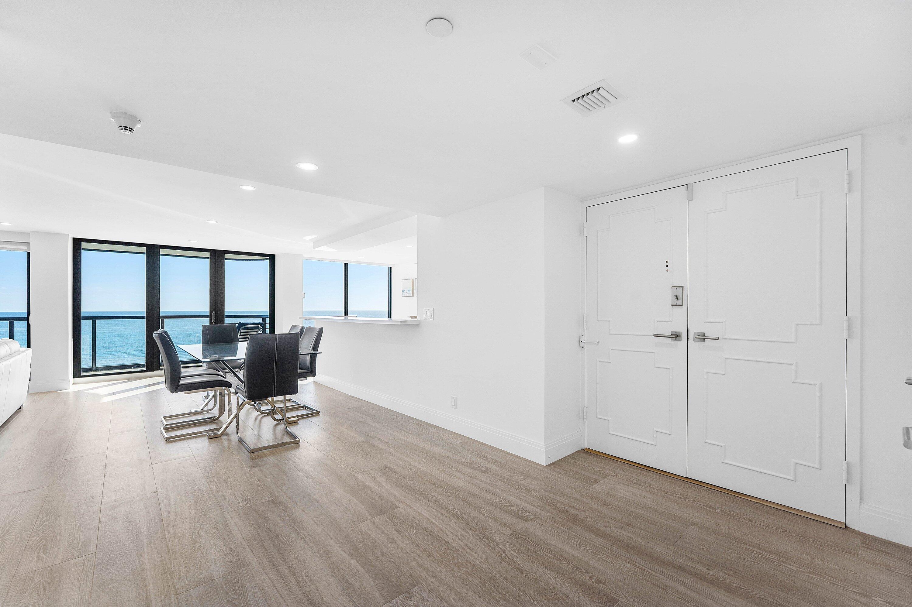 250 South Ocean Boulevard, Unit 4F Boca Raton, FL 33432 - Photo 3 of 45 a workspace with furniture hardwood and a window