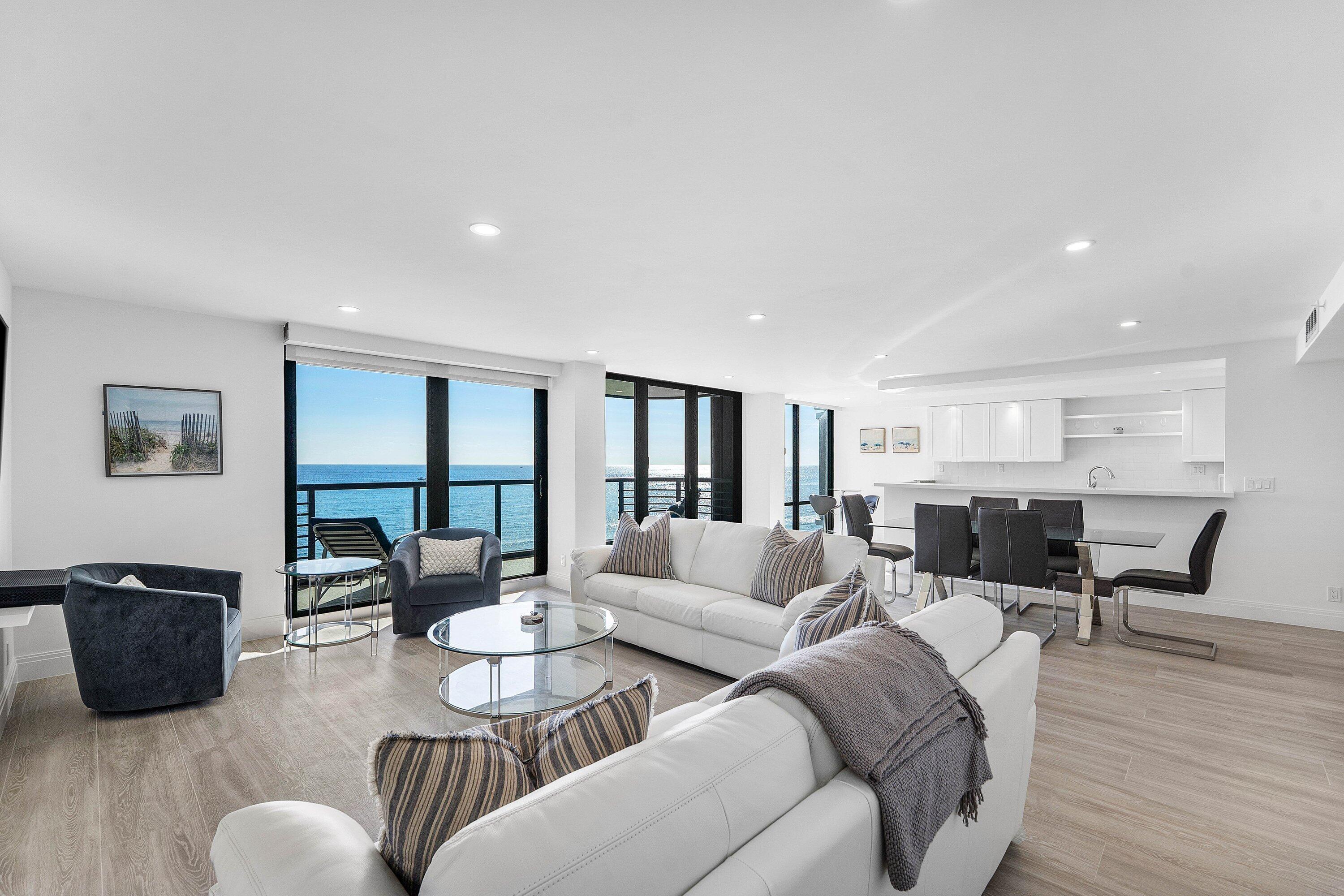 250 South Ocean Boulevard, Unit 4F Boca Raton, FL 33432 - Photo 4 of 45 a living room with furniture potted plant and a table