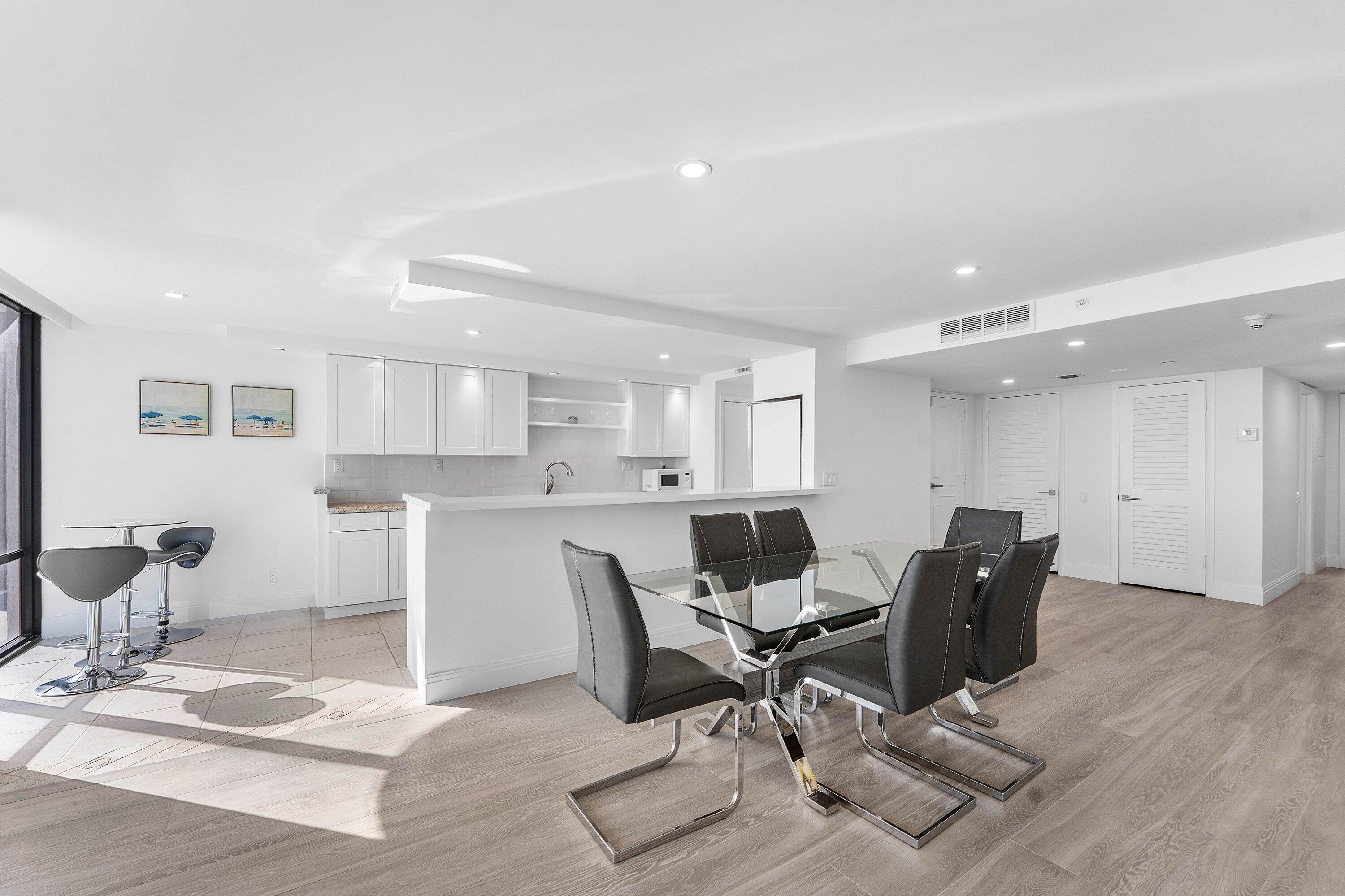 250 South Ocean Boulevard, Unit 4F Boca Raton, FL 33432 - Photo 10 of 45 a workspace with furniture and wooden floor