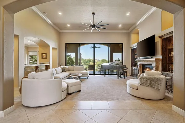 a living room with fireplace furniture and a flat screen tv