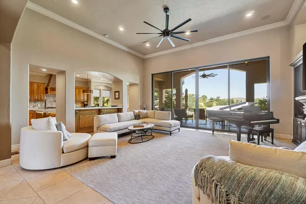 a living room with furniture and a large window