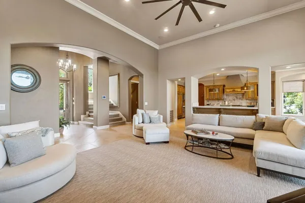 a view of a dining room with furniture large windows and wooden floor