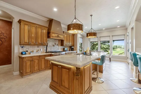 a view of a balcony with furniture and a floor to ceiling window