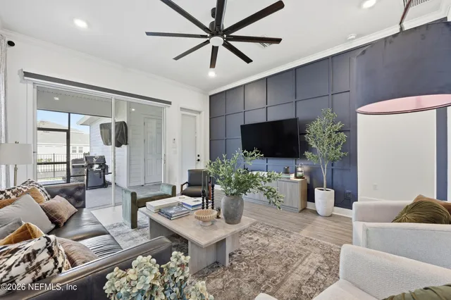 a view of a workspace with furniture and a workspace