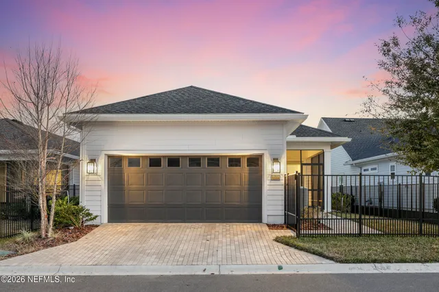 a view of a patio with swimming pool and sitting area