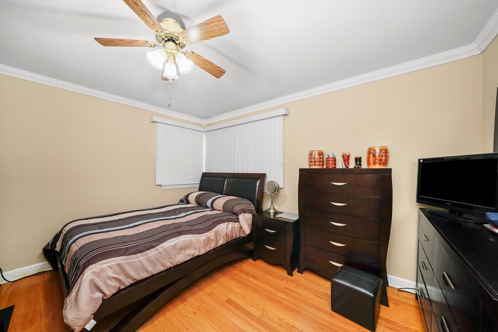 1106 Arthur Avenue Berkeley, IL 60163 - Photo 14 of 28 a bedroom with a bed and a chandelier