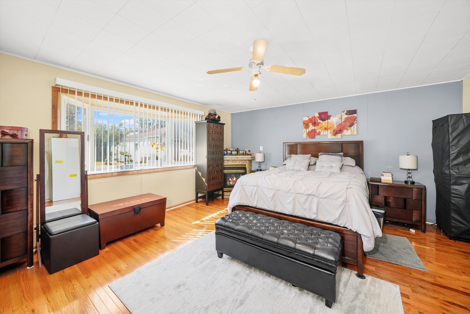 1106 Arthur Avenue Berkeley, IL 60163 - Photo 18 of 28 a bedroom with a bed and wooden floor