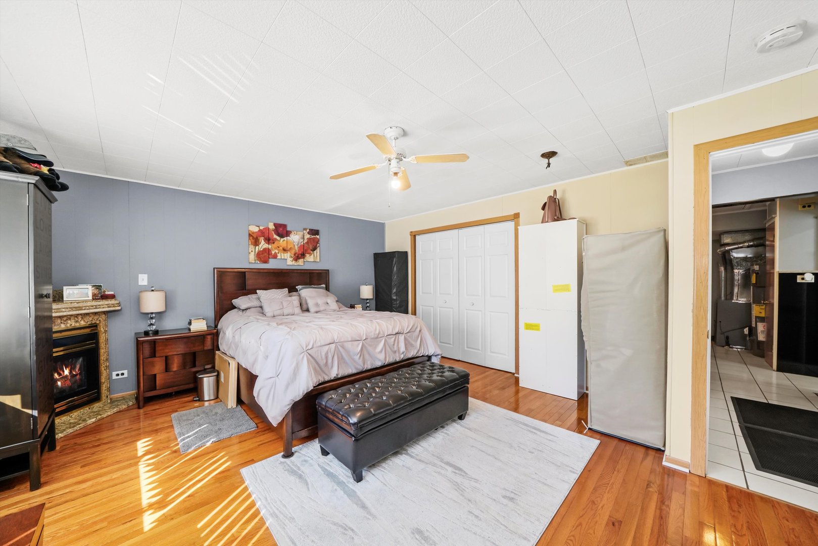1106 Arthur Avenue Berkeley, IL 60163 - Photo 19 of 28 a bed room with a bed and a ceiling fan