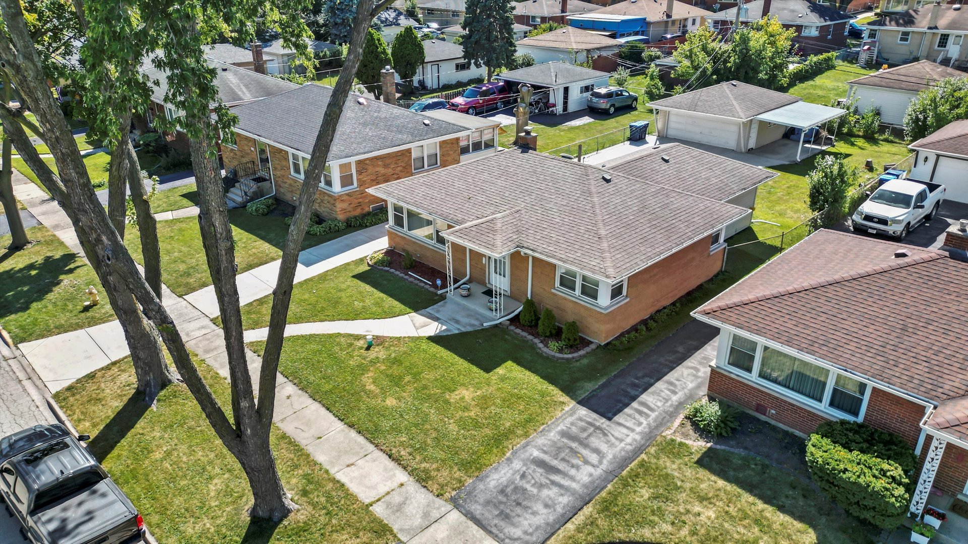 1106 Arthur Avenue Berkeley, IL 60163 - Photo 24 of 28 an aerial view of a house with swimming pool and a yard