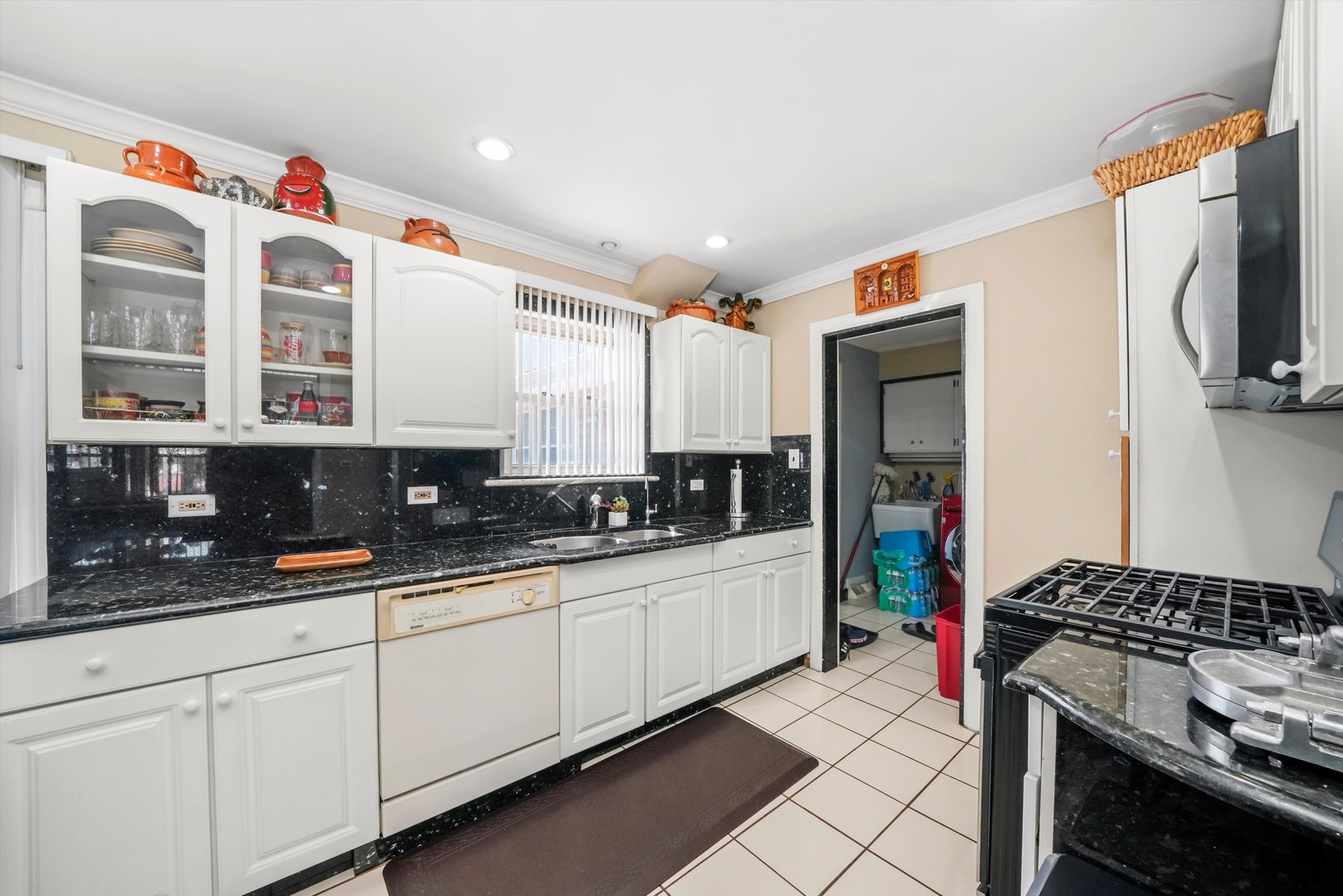 1106 Arthur Avenue Berkeley, IL 60163 - Photo 8 of 28 a kitchen with stainless steel appliances a sink a stove and cabinets
