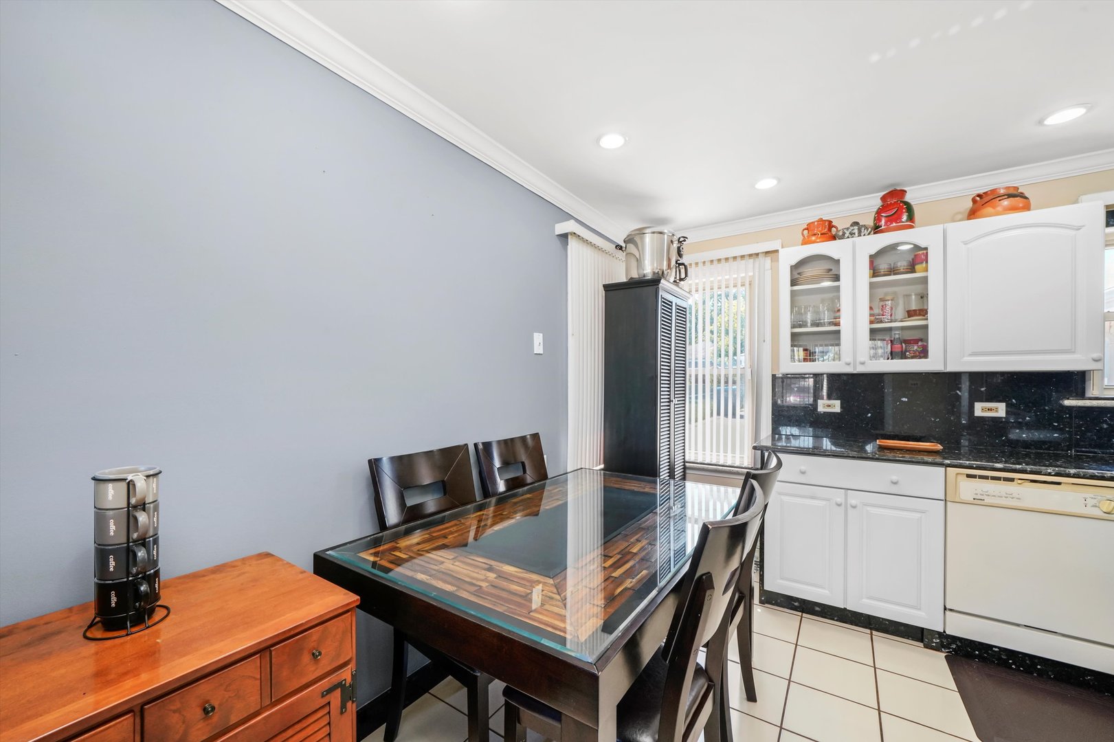 1106 Arthur Avenue Berkeley, IL 60163 - Photo 9 of 28 a kitchen that has a cabinets and a table in it