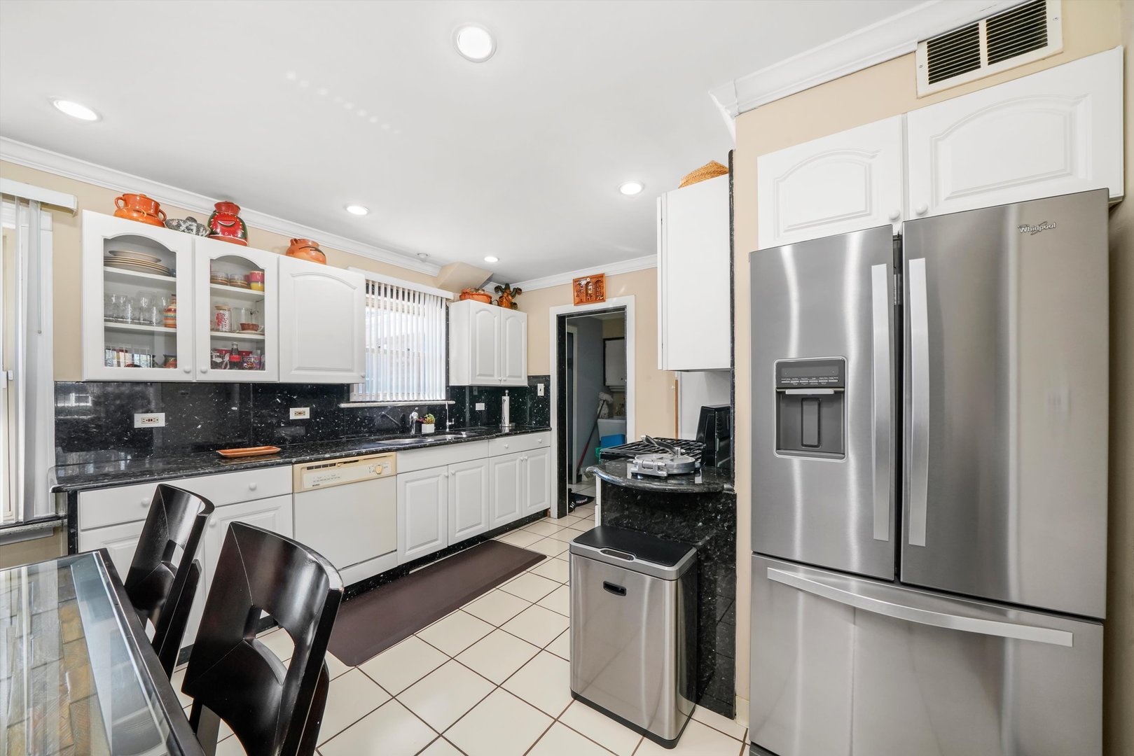 1106 Arthur Avenue Berkeley, IL 60163 - Photo 10 of 28 a kitchen with a refrigerator a sink and cabinets