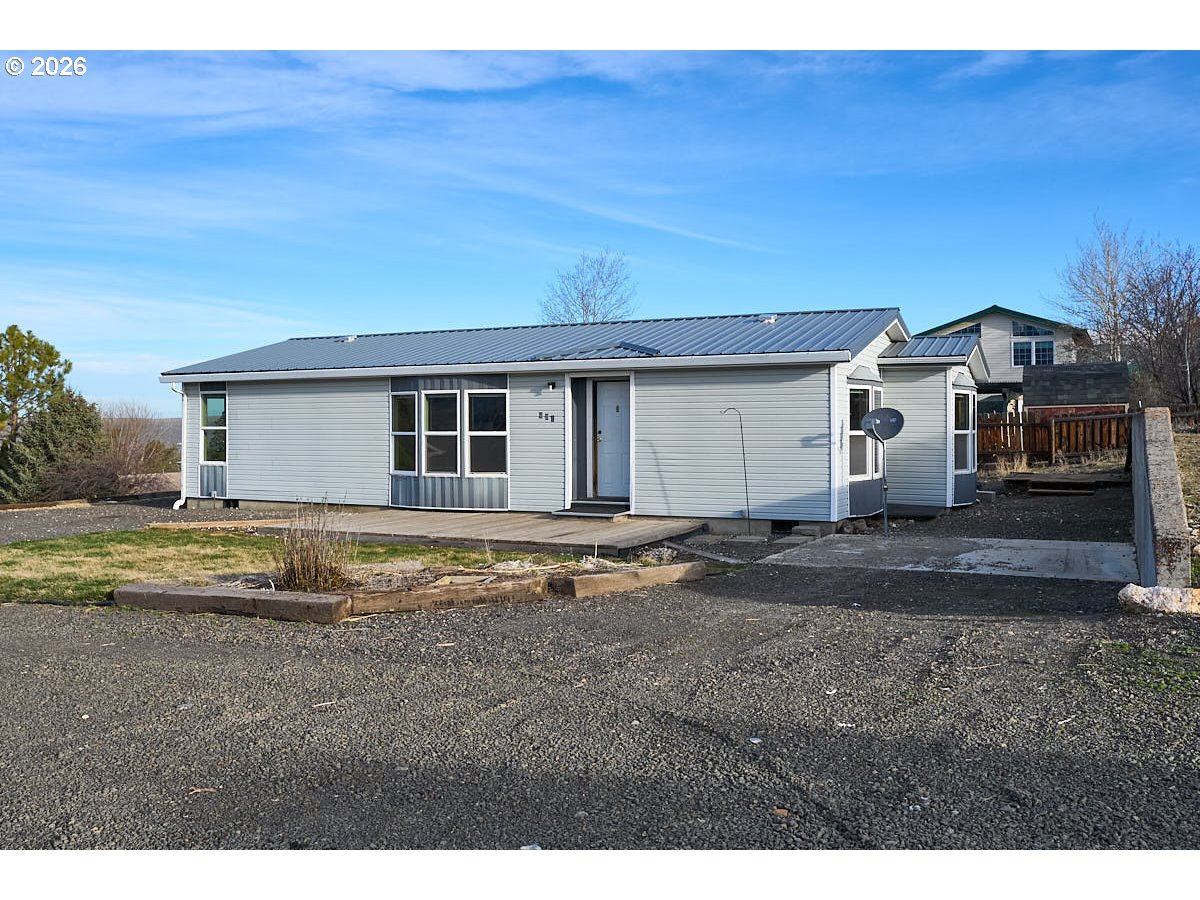 801 Residence Street Enterprise, OR 97828 - Photo 1 of 20 a view of a house with backyard and trees