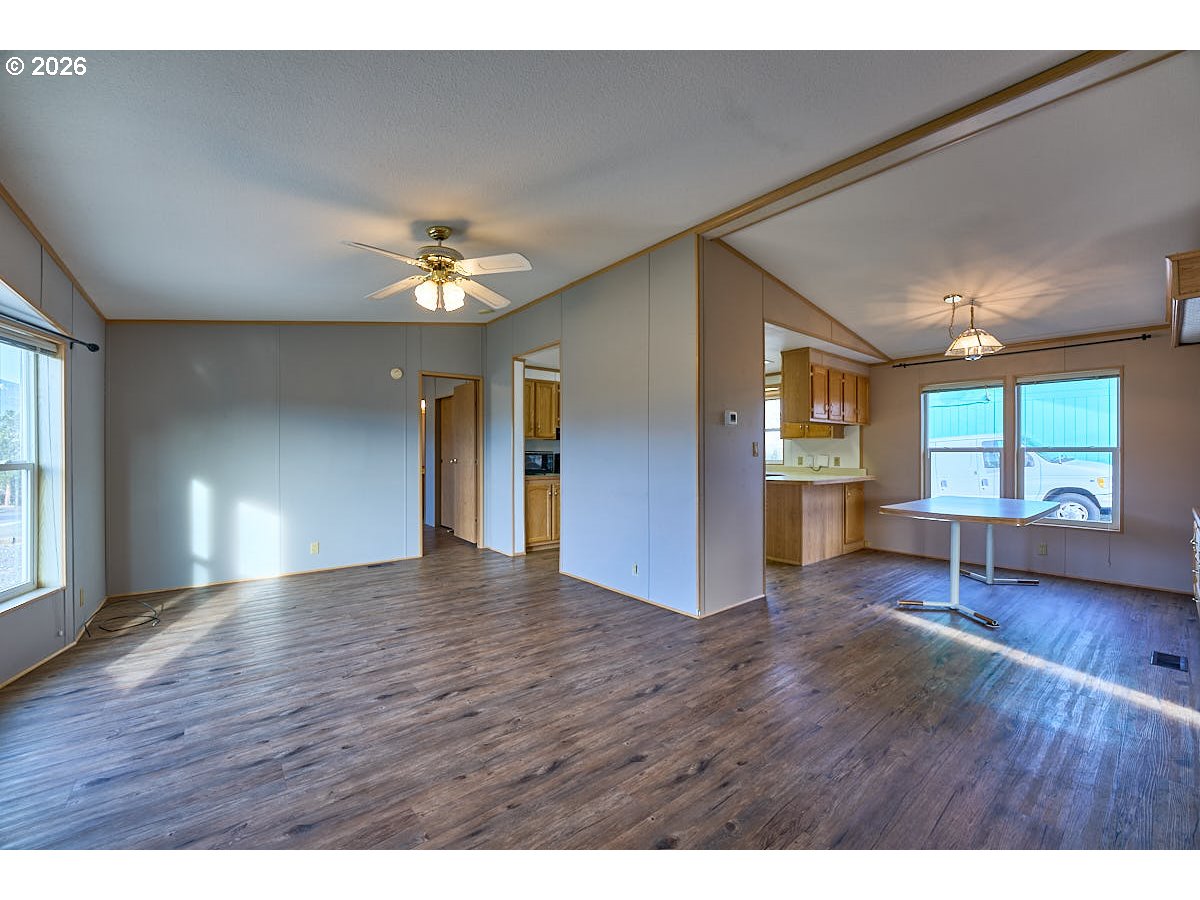 801 Residence Street Enterprise, OR 97828 - Photo 5 of 20 a view of an empty room with window and wooden floor