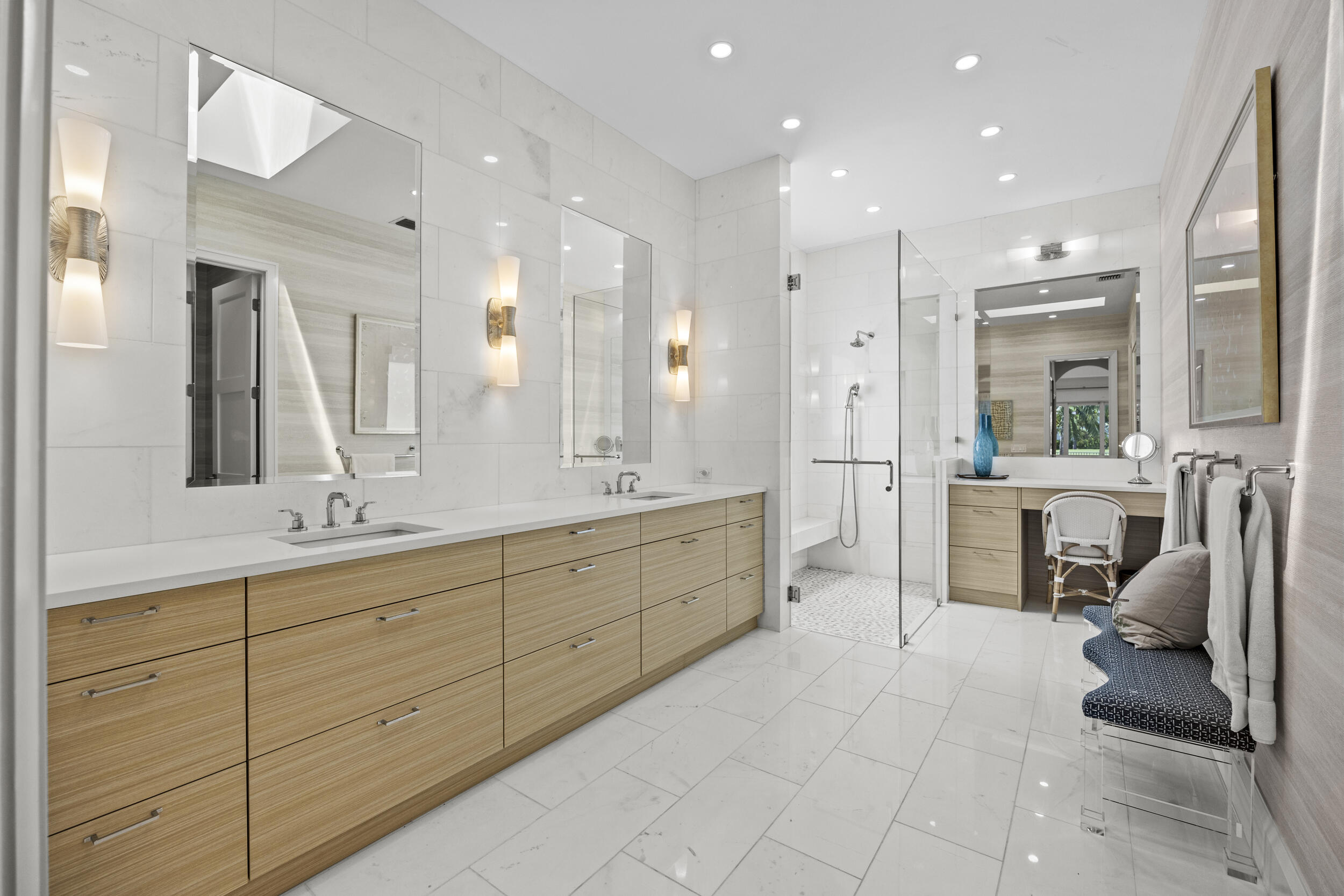 118 North Village Way Jupiter, FL 33458 - Photo 12 of 28 a large bathroom with a large mirror vanity and sink