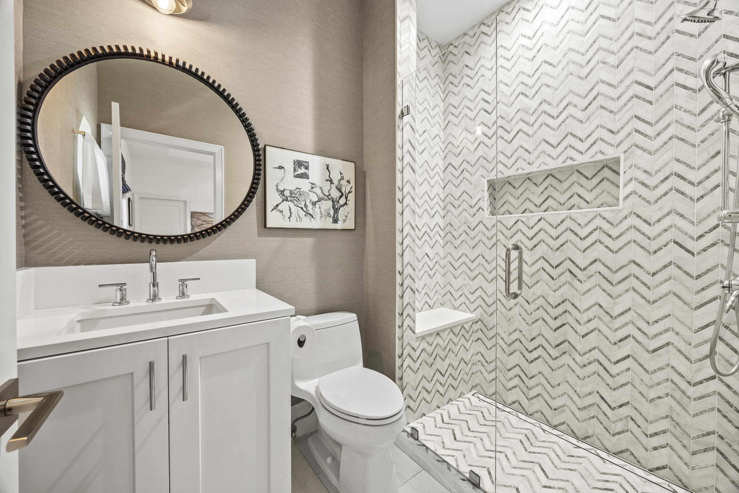 118 North Village Way Jupiter, FL 33458 - Photo 16 of 28 a bathroom with a toilet sink vanity and mirror