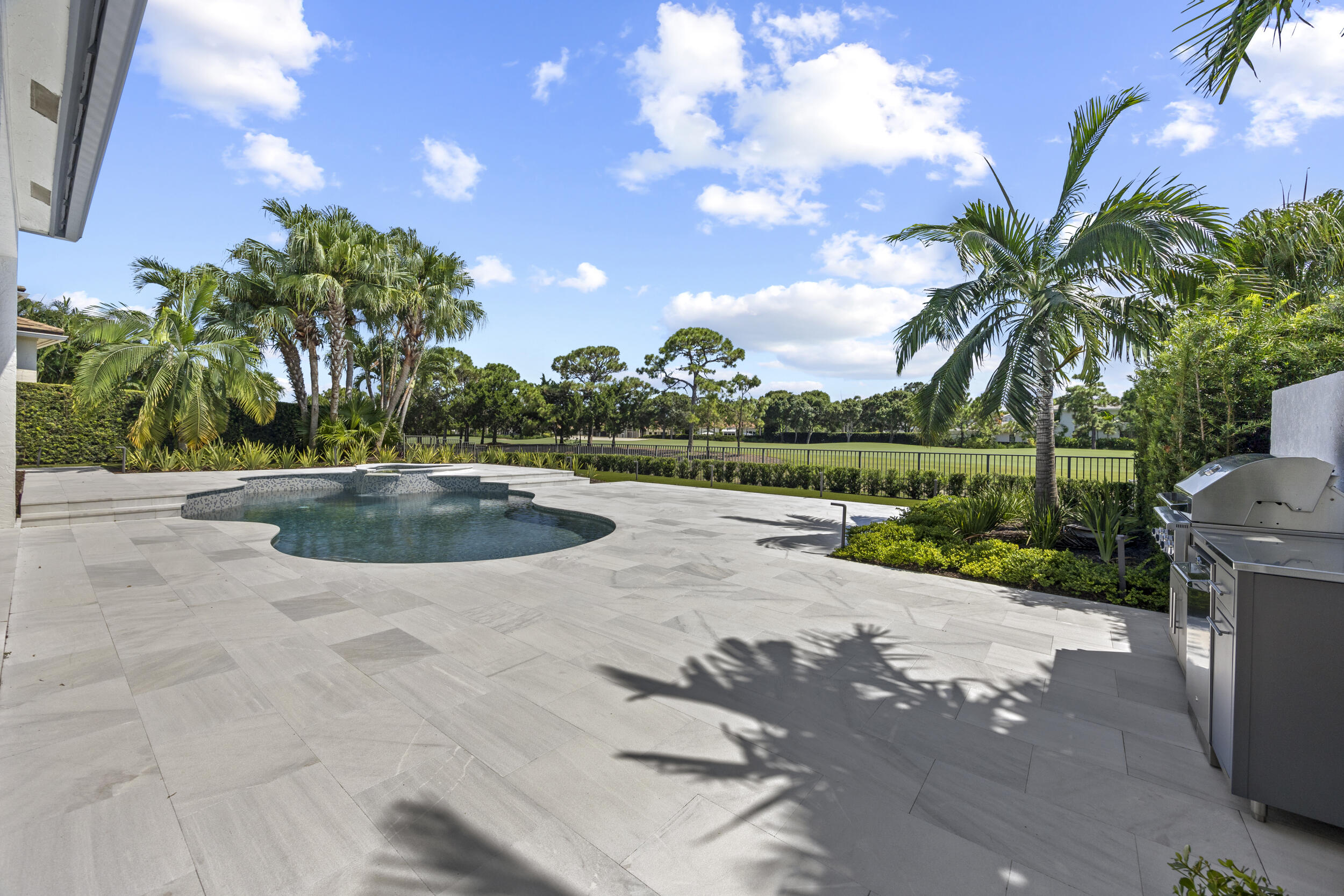 118 North Village Way Jupiter, FL 33458 - Photo 21 of 28 a view of a swimming pool with a yard