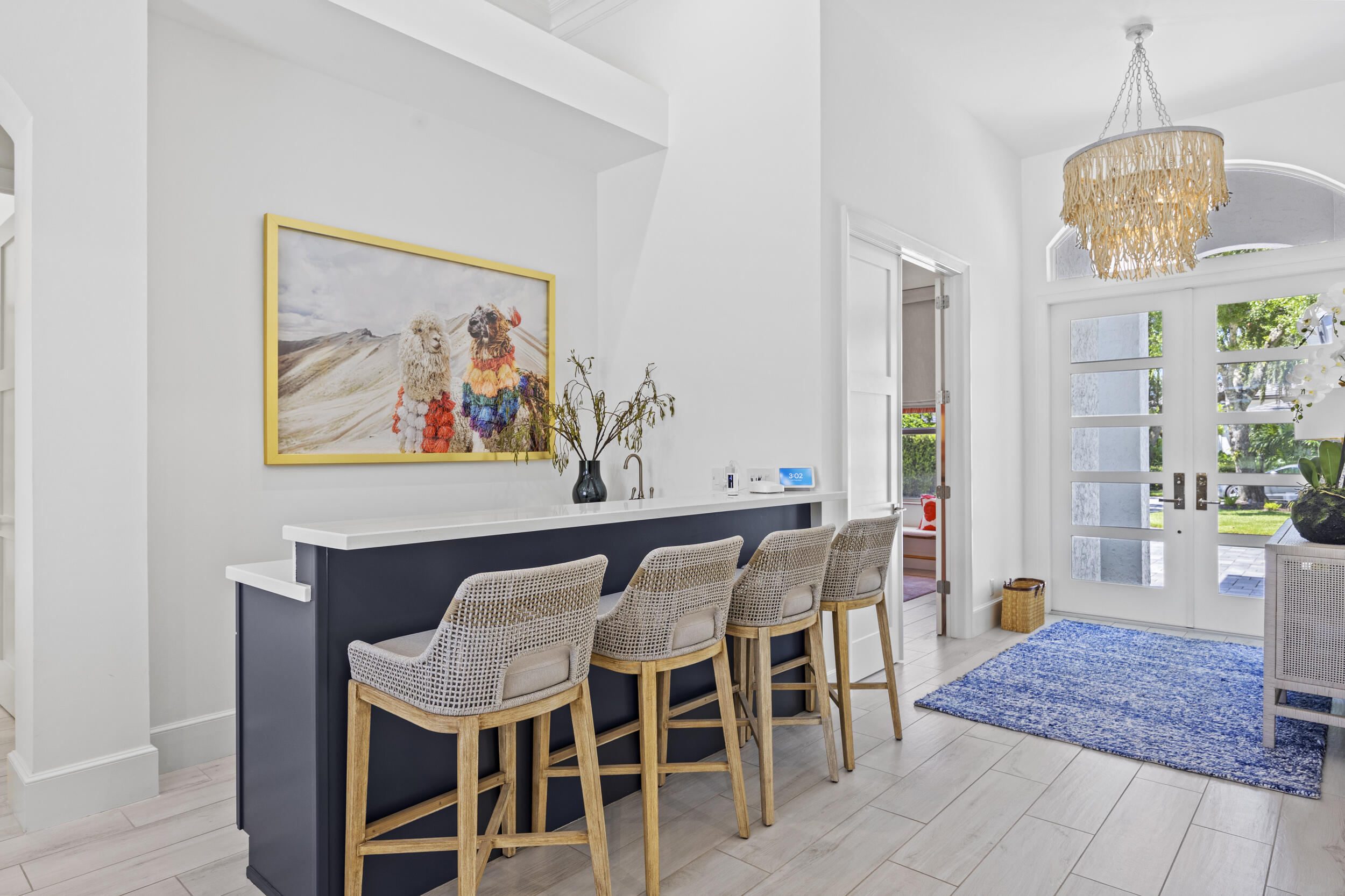 118 North Village Way Jupiter, FL 33458 - Photo 3 of 28 a view of a dining room with furniture and wooden floor