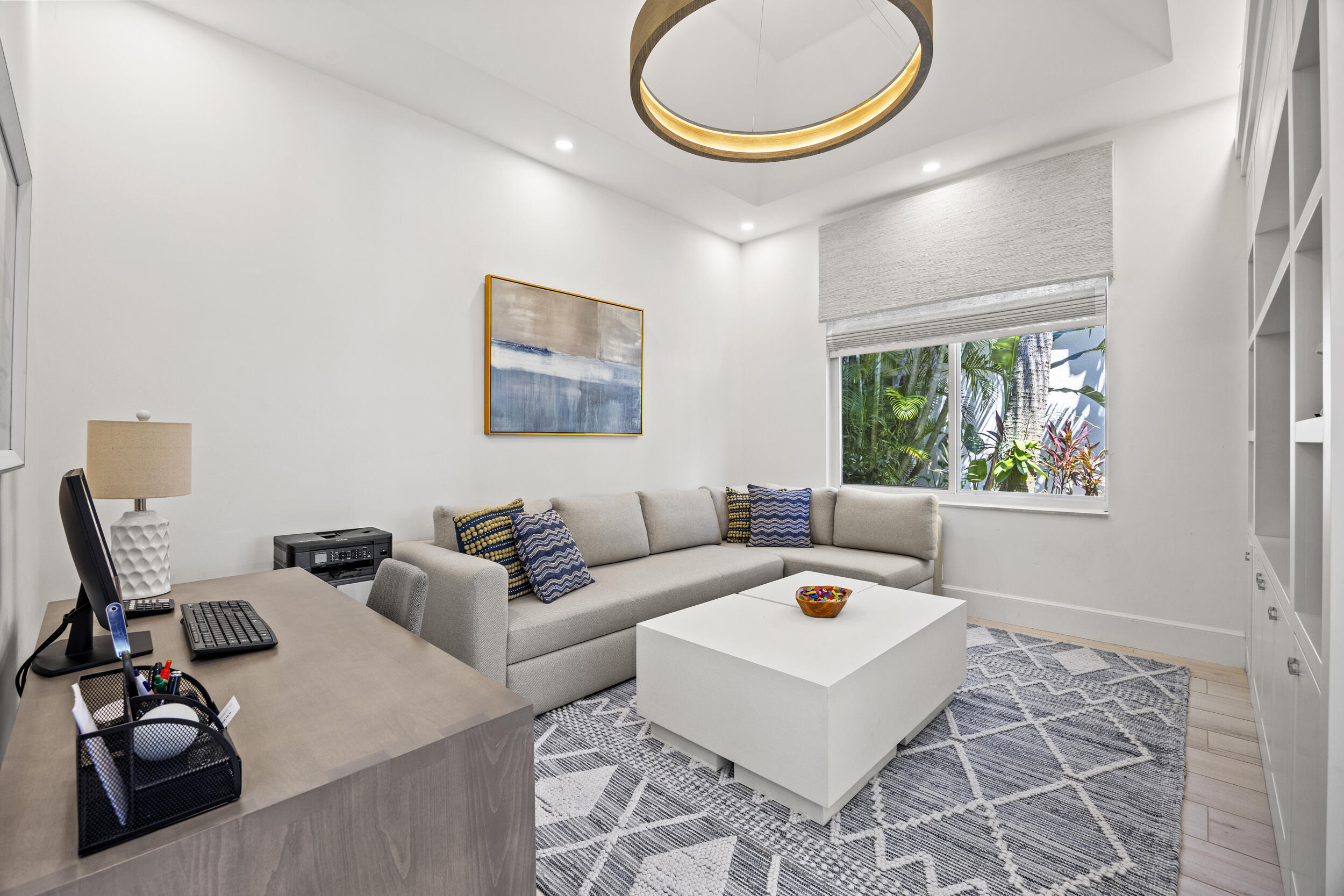 118 North Village Way Jupiter, FL 33458 - Photo 7 of 28 a living room with furniture a rug and a window