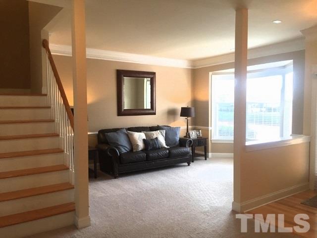 9525 Vira Drive Raleigh, NC 27617 - Photo 2 of 13 a living room with furniture and a large window