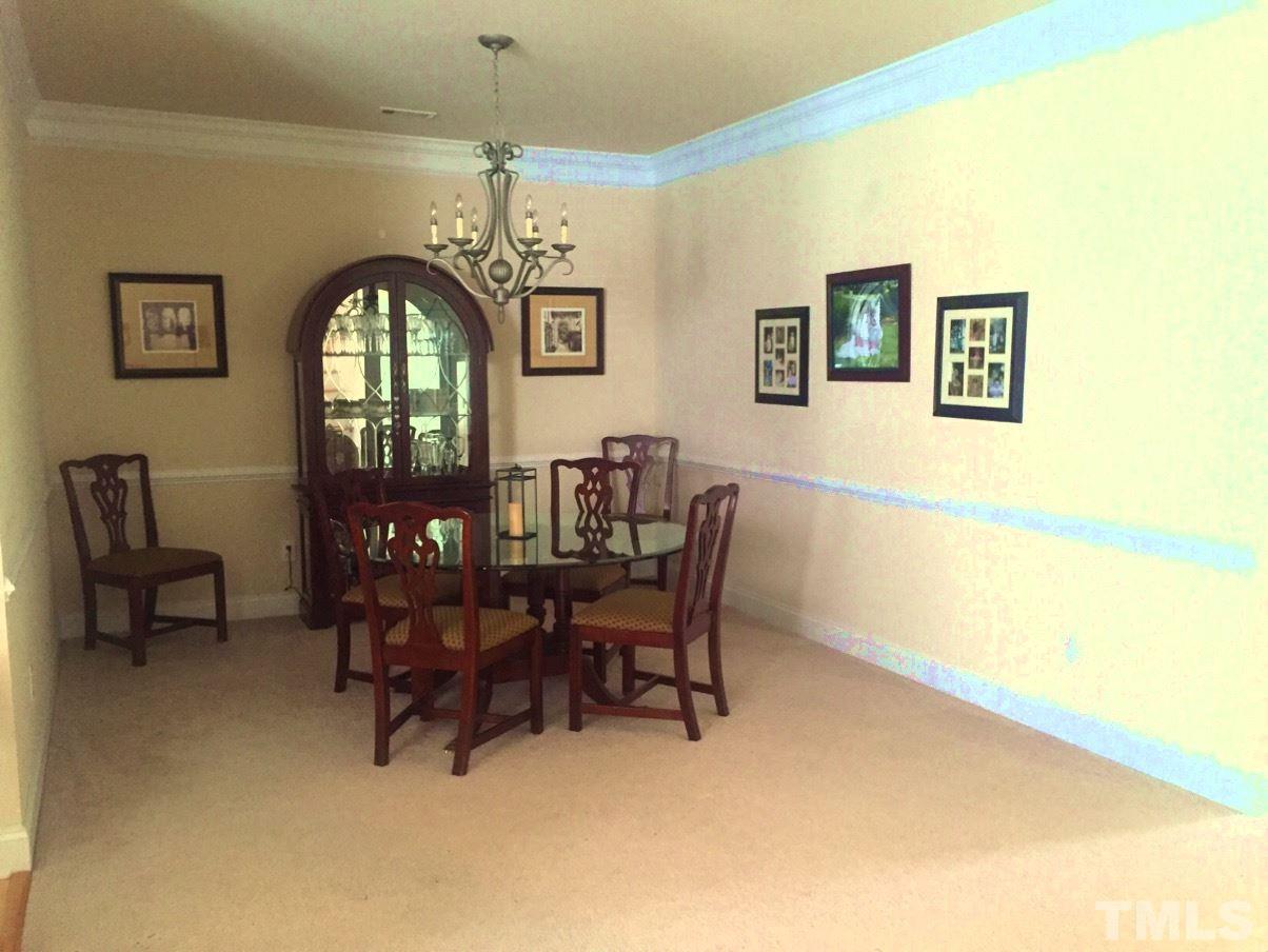 9525 Vira Drive Raleigh, NC 27617 - Photo 3 of 13 a dining room with furniture and window