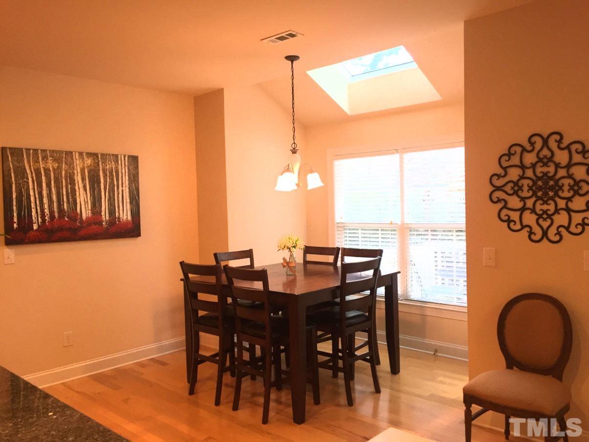 9525 Vira Drive Raleigh, NC 27617 - Photo 5 of 13 a view of a dining room with furniture window and wooden floor