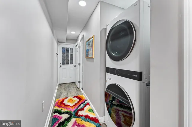 a view of a hallway with washer and dryer