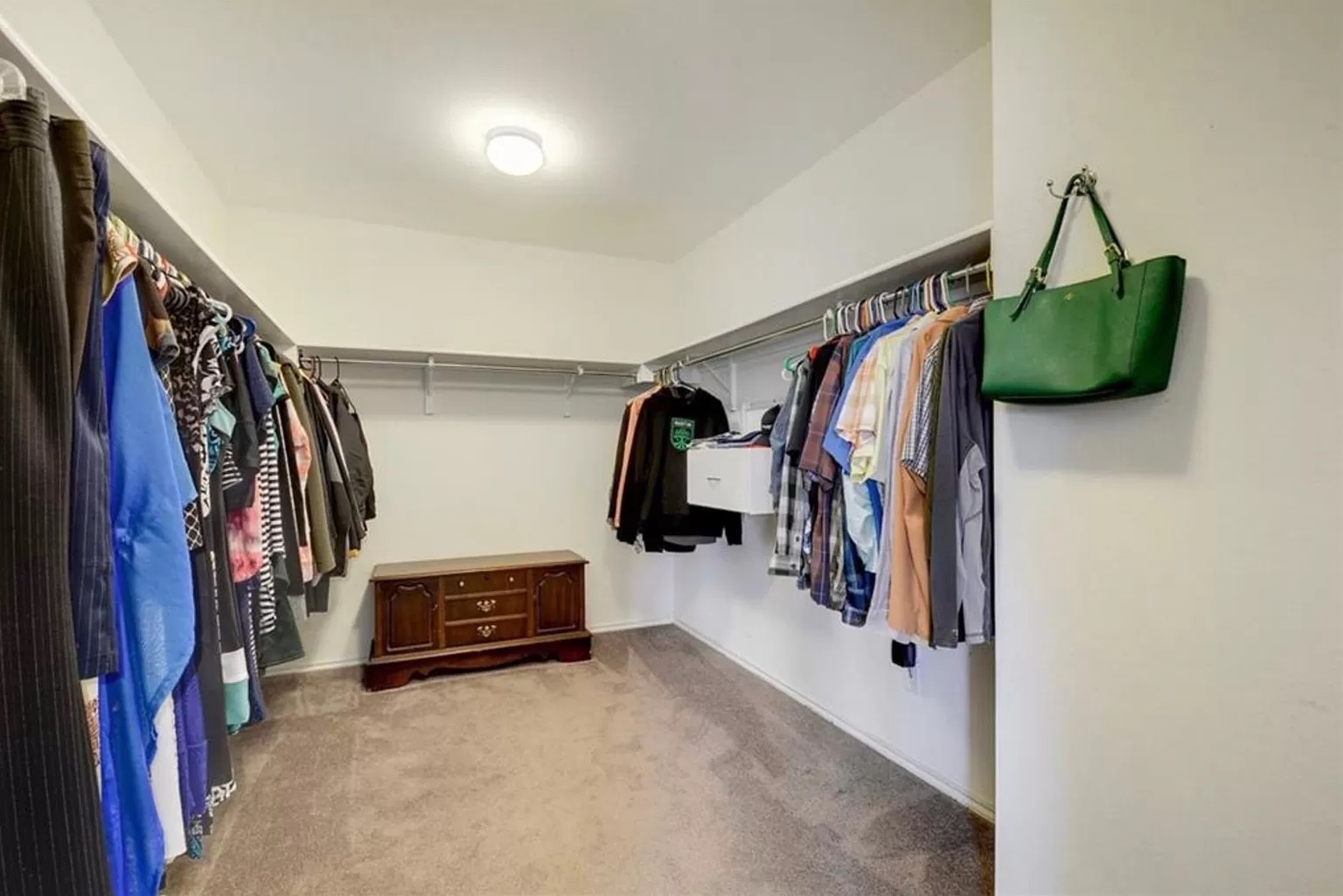 9016 Ridgewell Road Austin, TX 78747 - Photo 19 of 30 Ample hanging space and easy-care carpeting define this practical walk-in closet.