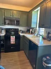 a kitchen with a sink and a stove